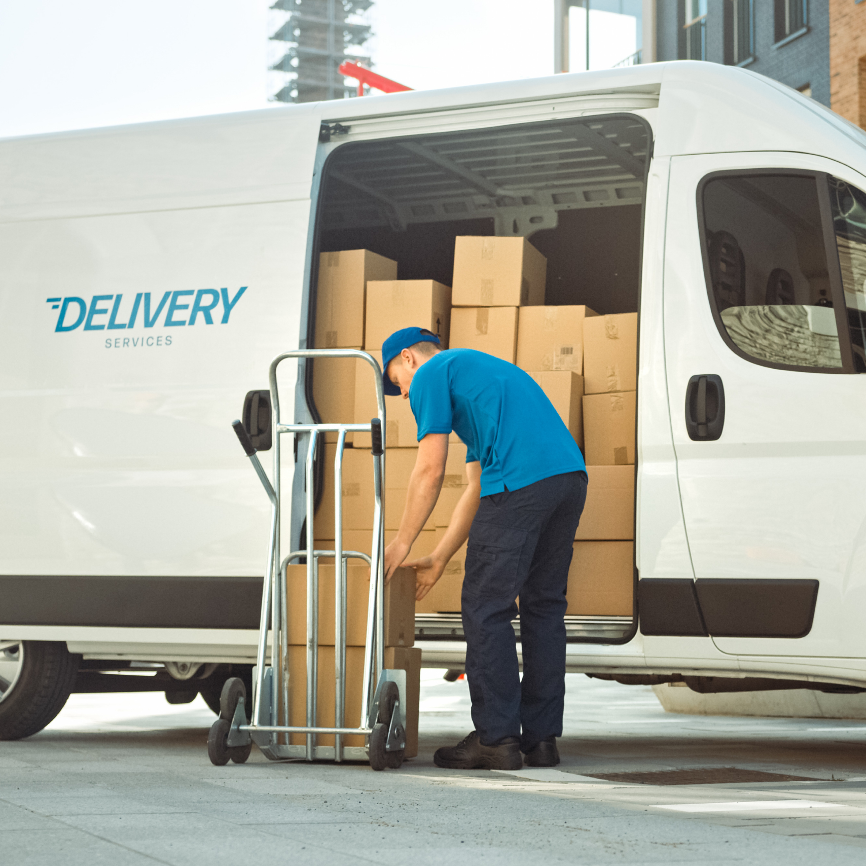 delivery man un-packing his van