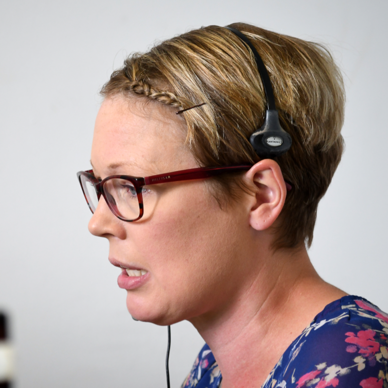 side profile of a woman with a headset on