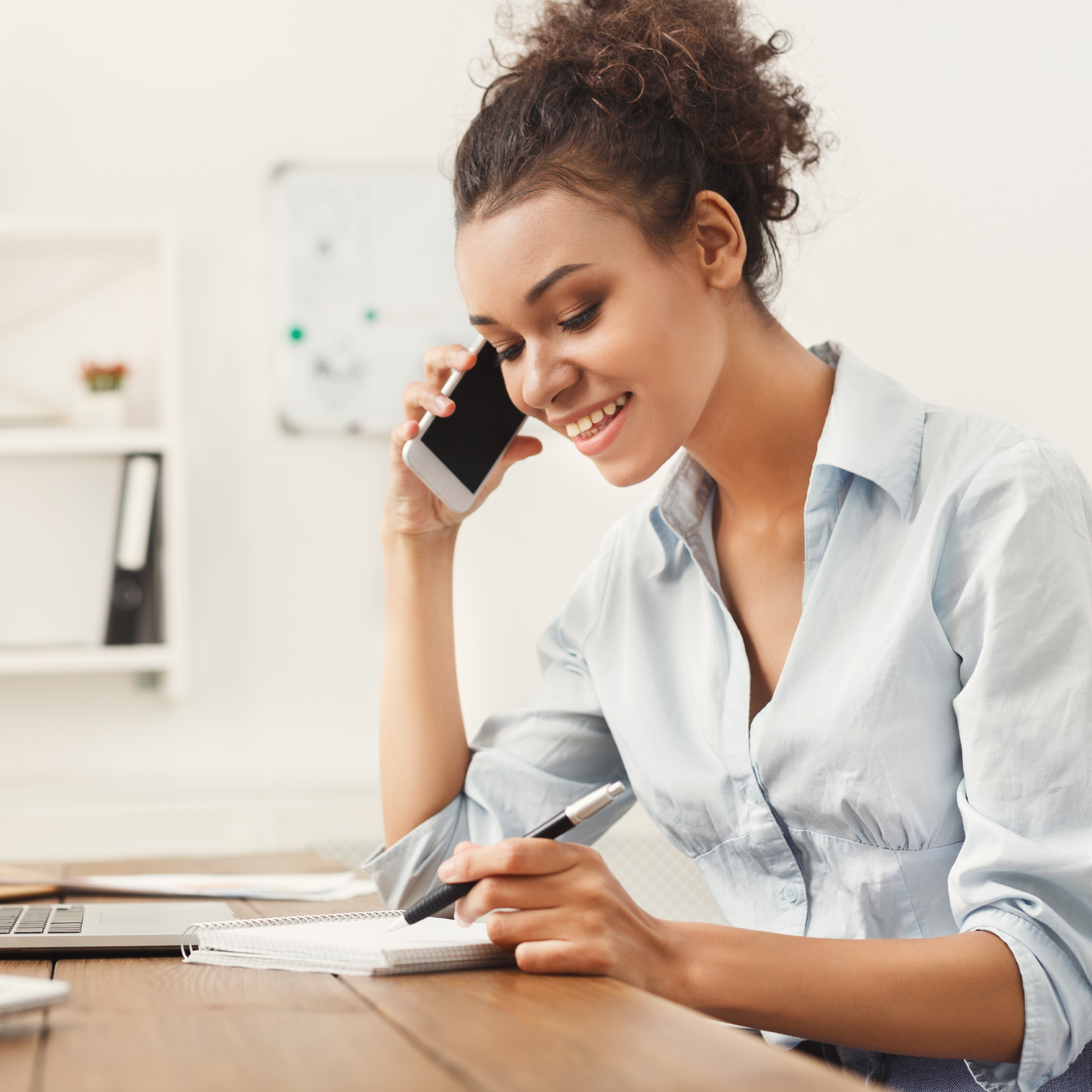 woman on the phone looking relieved
