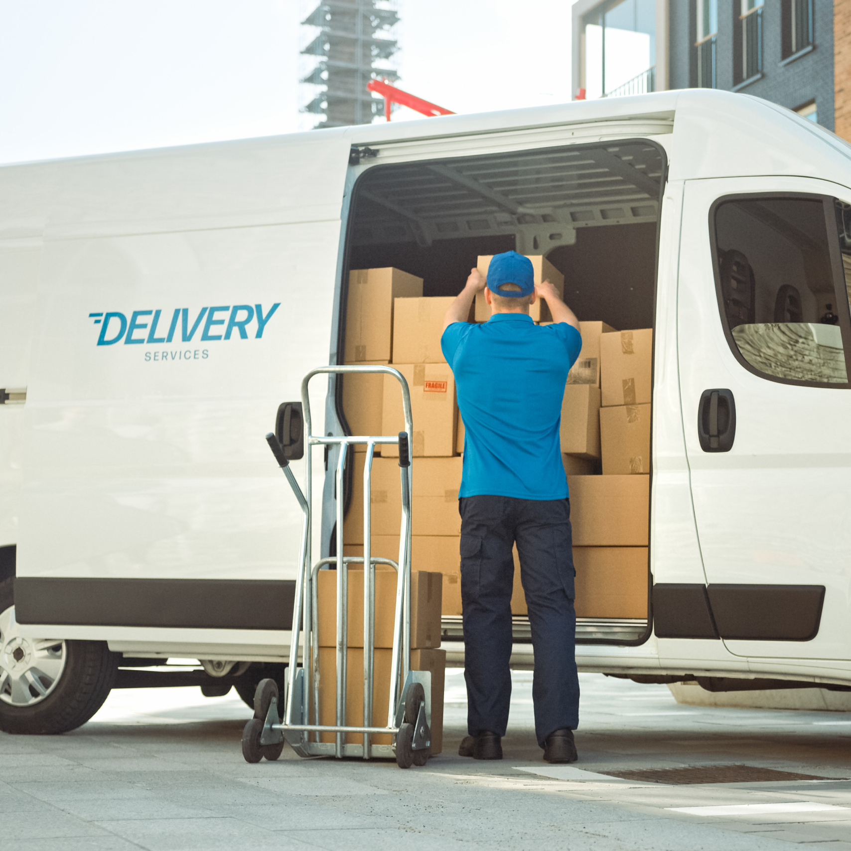 man filling delivery van