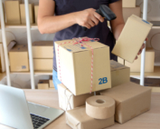 man scanning parcels in his office