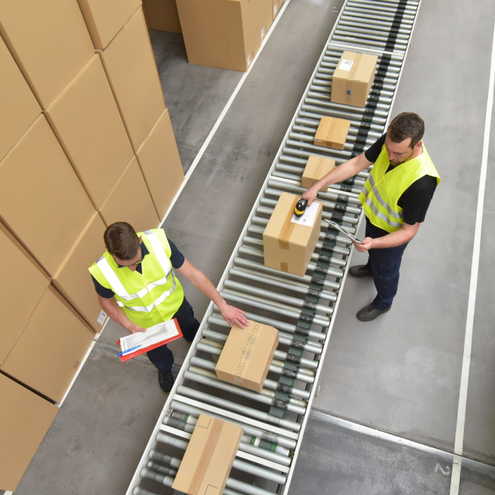 parcels being checked in a warehouse on a conveyor belt